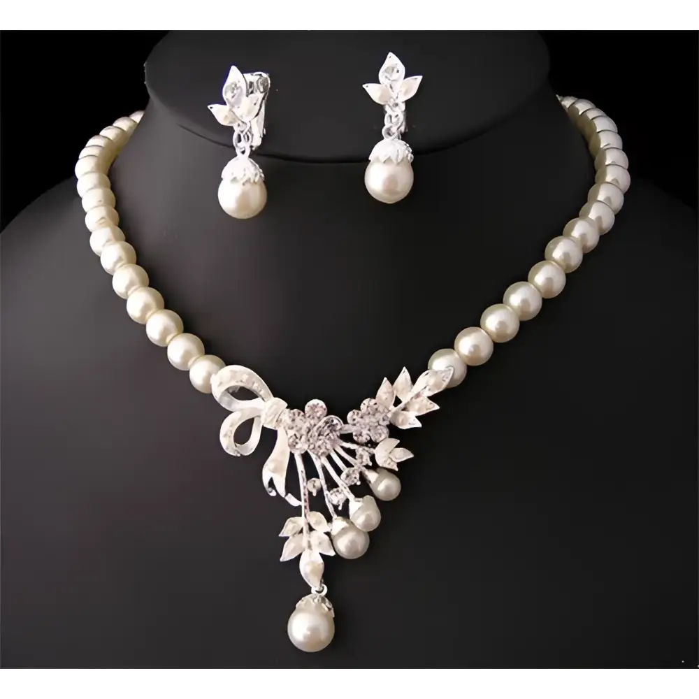 Pearl and crystal bridal ornaments jewelry set with cream pearls and silver crystal floral design for wedding gowns and bow pendant