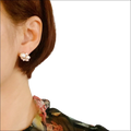 Pearl and cubic zirconia cluster stud earrings with white pearls and clear gemstones in silver-toned metal frame for luxury women’s fashion