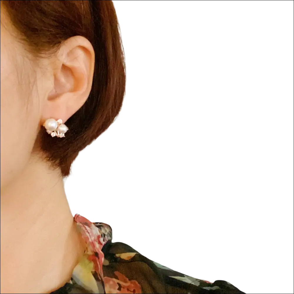 Pearl and cubic zirconia cluster stud earrings with white pearls and clear gemstones in silver-toned metal frame for luxury women’s fashion