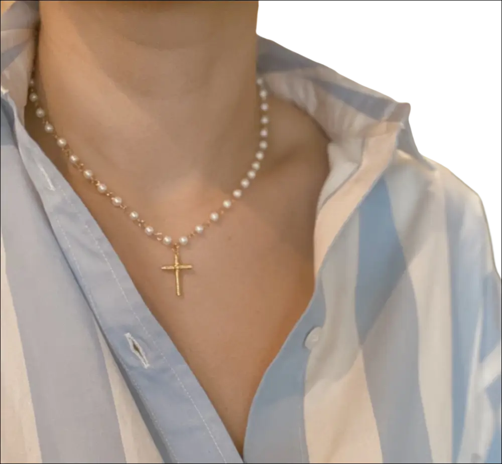 A delicate gold cross pendant necklace with small lustrous pearls perfect for luxury women’s fashion