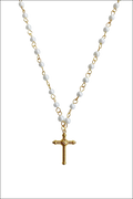 A delicate gold-toned cross pendant necklace with white pearls and gold links for luxury women’s fashion