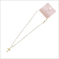 A delicate white pearl cabled rope cross pendant necklace with gold-tone accents on a pink Ellison Young tag