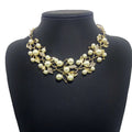 Gold-toned pearl clover necklace jewelry with cream pearls leaf motifs and rhinestone accents earrings featuring design