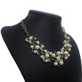 Silver-toned pearl clover necklace jewelry featuring intricate vine design with cream pearls and rhinestones earrings