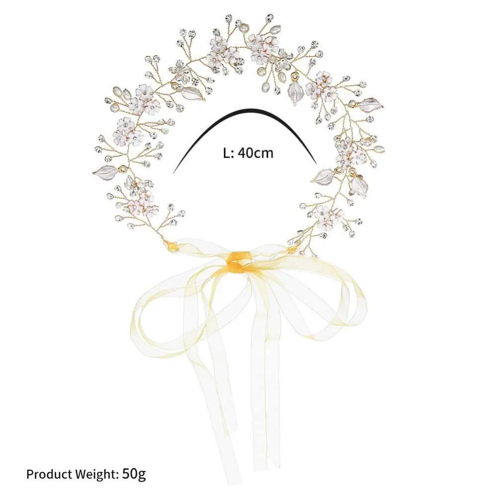 Elegant pearl handmade headband featuring gold-toned alloy flower crystal and delicate pink crystals with yellow ribbon bow