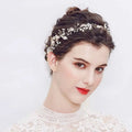A delicate pearl handmade headband featuring alloy flower crystal accents in silver with pearls and crystals