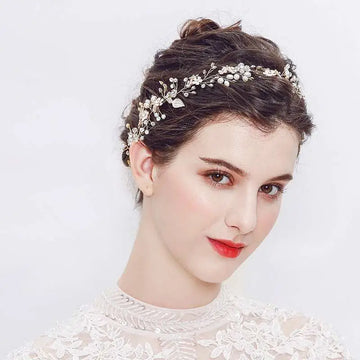 A delicate pearl handmade headband featuring alloy flower crystal accents in silver with pearls and crystals