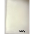 Ivory-colored fabric swatch showcasing the soft textured surface of a luxury wedding veil with delicate white pearl beaded accents