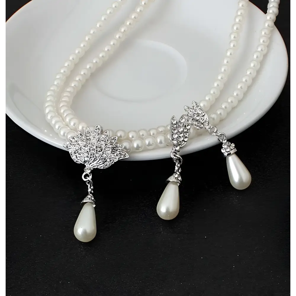 Elegant double-strand pearl lotus pendant alloy necklace set with silver leaf clasps and teardrop pearls for bride wedding