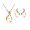 Gold-toned pearl necklace and earrings set popular featuring swirling design with clear rhinestones for dinner bridal