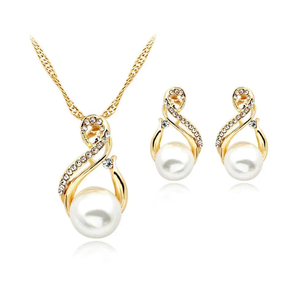 Gold-toned pearl necklace and earrings set popular featuring swirling design with clear rhinestones for dinner bridal