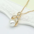 Gold-toned pearl necklace with swirling clear crystals and white pearl in earrings set popular for dinner bridal use