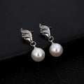 Silver wing-shaped earrings with clear rhinestones and white pearls complement pearl rhinestone necklace explosion models accessories sold on united states ebay