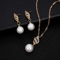 Elegant gold-toned pearl rhinestone necklace and wing-shaped earrings set featuring white pearls and sparkling rhinestones sold United States eBay explosion models accessories