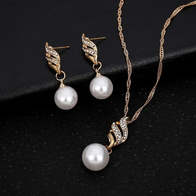Elegant gold-toned pearl rhinestone necklace and wing-shaped earrings set featuring white pearls and sparkling rhinestones sold United States eBay explosion models accessories