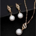 Gold-toned wing-shaped pearl rhinestone necklace and earrings set featuring lustrous white pearls for united states ebay explosion models accessories