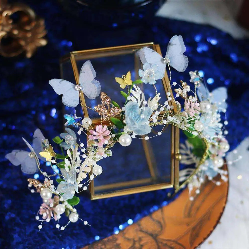 Performance butterfly garland headdress with ornate floral and butterfly design featuring blue pink gold embellishments pearls and gemstones