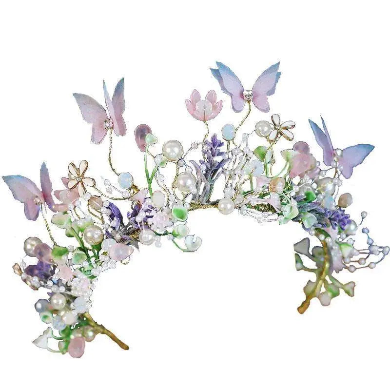 Delicate performance butterfly garland headdress with pastel butterflies, translucent flowers, and pearl clusters in soft hues