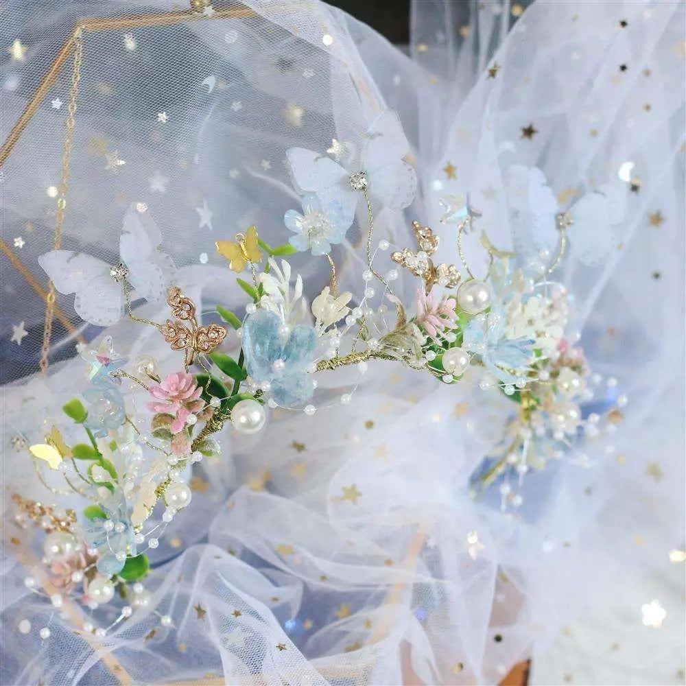 Delicate performance butterfly garland headdress with translucent blue pink blossoms golden butterflies and pearl accents