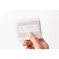 A pale lavender rectangular soap wrapped in purple paper labeled lavender soap for personalized ashley pampering natural skincare mom gift