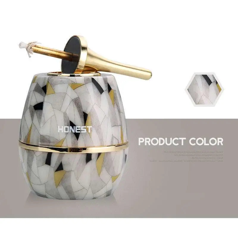 A personalized metal creative oil-electric hybrid lighter with a sleek honey pot design and mosaic pattern in white black and gold