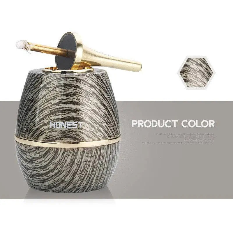 A personalized metal creative oil-electric hybrid lighter with a sleek barrel shape black silver marble finish and gold accents