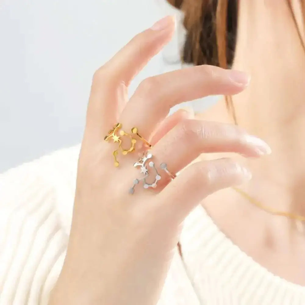 Personalized stainless steel constellation ring with gold and silver star designs in an intricate connector pattern