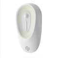 White plastic pet odor eliminator night light with circular button and vertical slider for litter boxes
