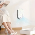 White wall-mounted pet odor eliminator night light with sleek oval design and blue mist for litter boxes