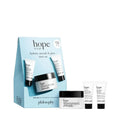 Light blue rectangular gift box with black text and white tubes featuring the philosophy hope 3 piece skincare set