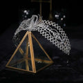 A sparkling silver rhinestone crown luxury bridal headdress with an intricate phoenix motif and delicate design