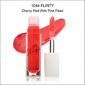 Cherry red lip gloss with pink pearl shimmer in a clear glass tube by fhdera for luxury women’s fashion looks
