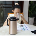 Gold-colored stainless steel electric kettle double insulated with black handle and lid from pink 1.8l model