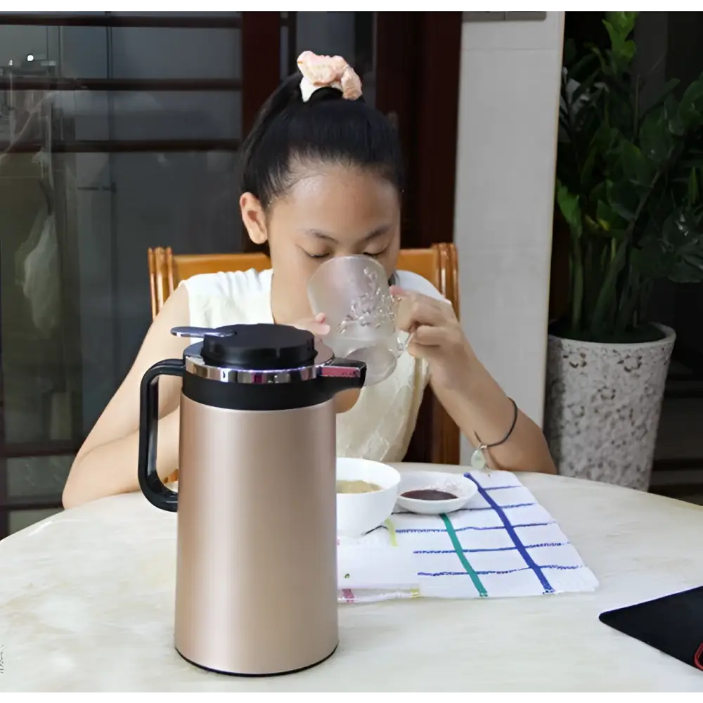 Gold-colored stainless steel electric kettle double insulated with black handle and lid from pink 1.8l model