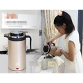 Pink 1.8l rose gold stainless steel electric kettle double insulated with black handle and sleek modern design