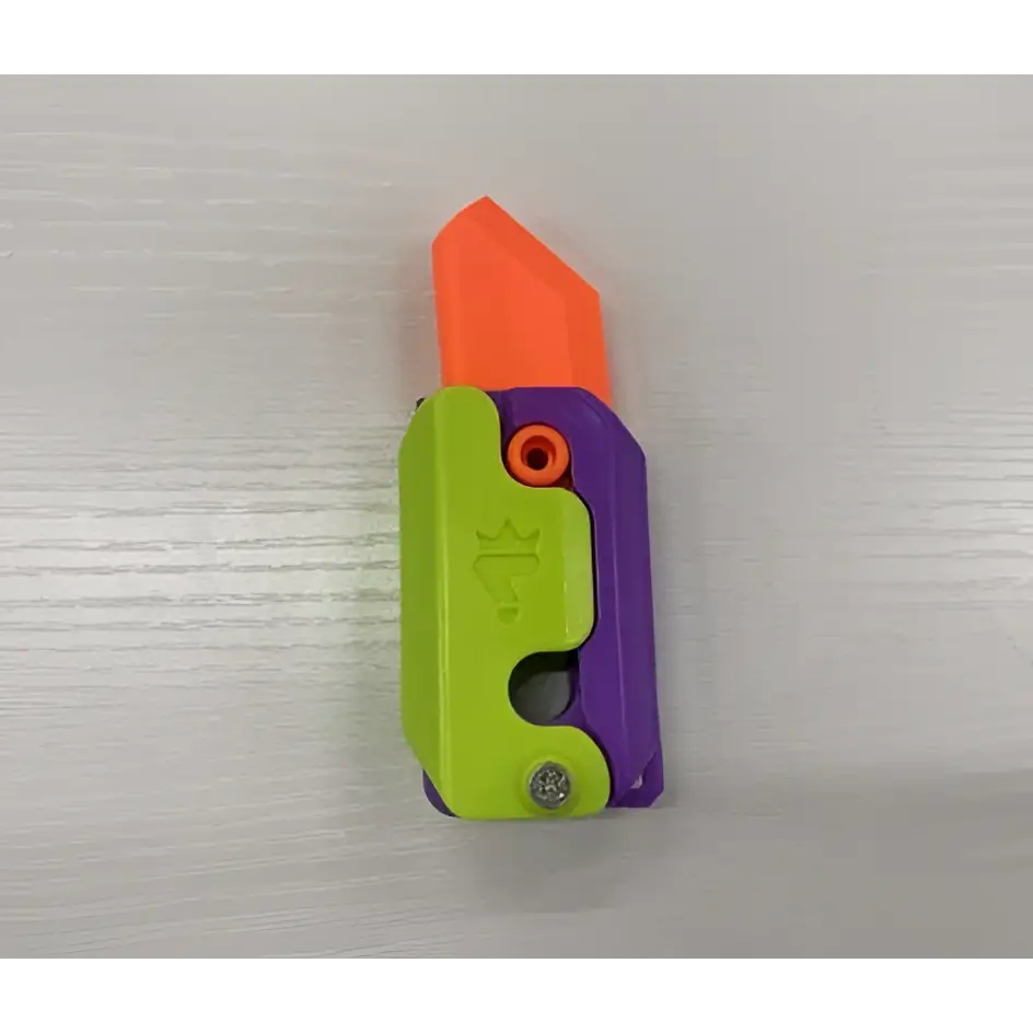 A vibrant gravity cub toy lime radish knife with a bright orange blade and lime green purple handle for printing gravity cub