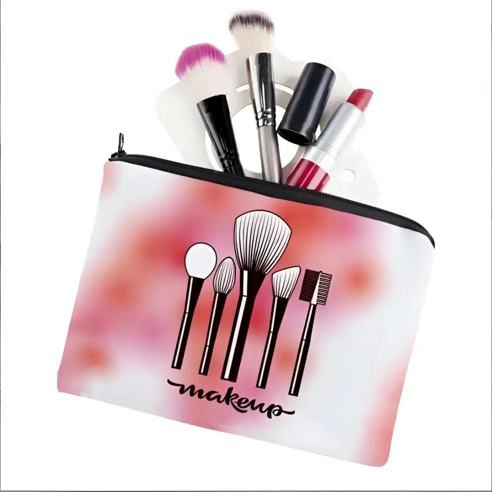 Pink and white cosmetics pattern zipper makeup bag with black zipper and printed illustration of five makeup brushes