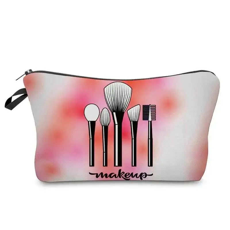 Pink and white cosmetics pattern zipper makeup bag with black brush silhouettes and makeup cursive script design