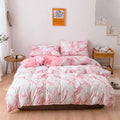 Pink and white marble bed sheets set featuring a marble pattern duvet cover and white marble bed design