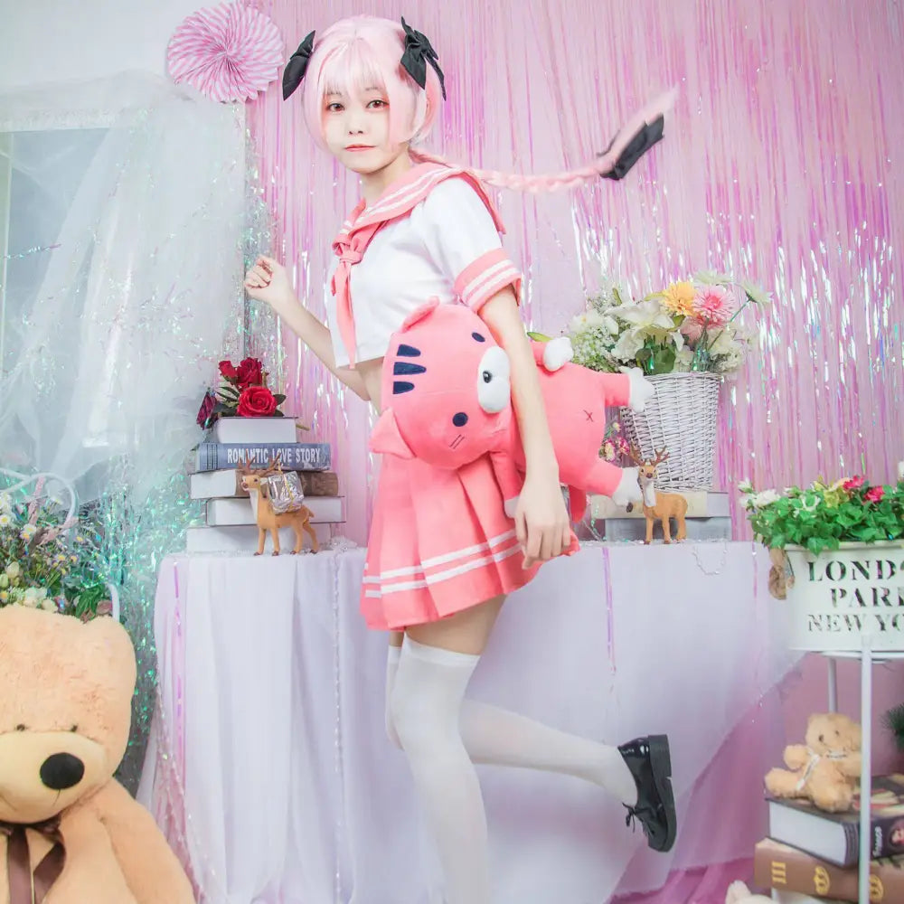 Pink and white sailor suit cosplay costume fgo with black ribbon accents featuring a pink plush cat accessory