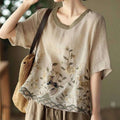 Beige linen round neck top with pink art retro embroidery and olive green neckline and hem detailing