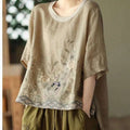 Beige linen round neck top with pink art retro embroidery and delicate floral design featuring scalloped hem