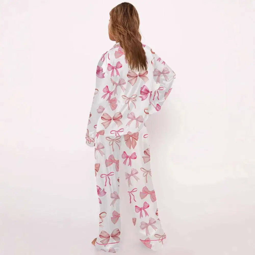 White pyjama suit with pink bow print in soft fabric and long sleeves for comfortable loungewear