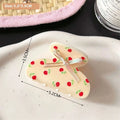Cream-colored small jaw clip with red rose decals and silver ribbon bow secure jaw clip pink butterfly floral design