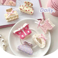 Pastel pink butterfly floral small jaw clip with bow features secure jaw clip and delicate polka dot patterns