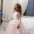 A delicate pink butterfly lace girls pengpeng skirt with long lace sleeves and white butterfly appliqués on tulle