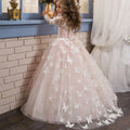 A delicate blush pink ball gown with lace girls pengpeng bodice and intricate white butterfly appliqués