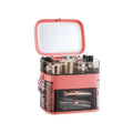 Pink plastic cosmetic storage box with transparent compartments and a mirrored lid for celebrity desktop organization