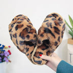 Pink cross strap slippers leopard plush house shoes with fuzzy plush tan base and dark brown leopard spots