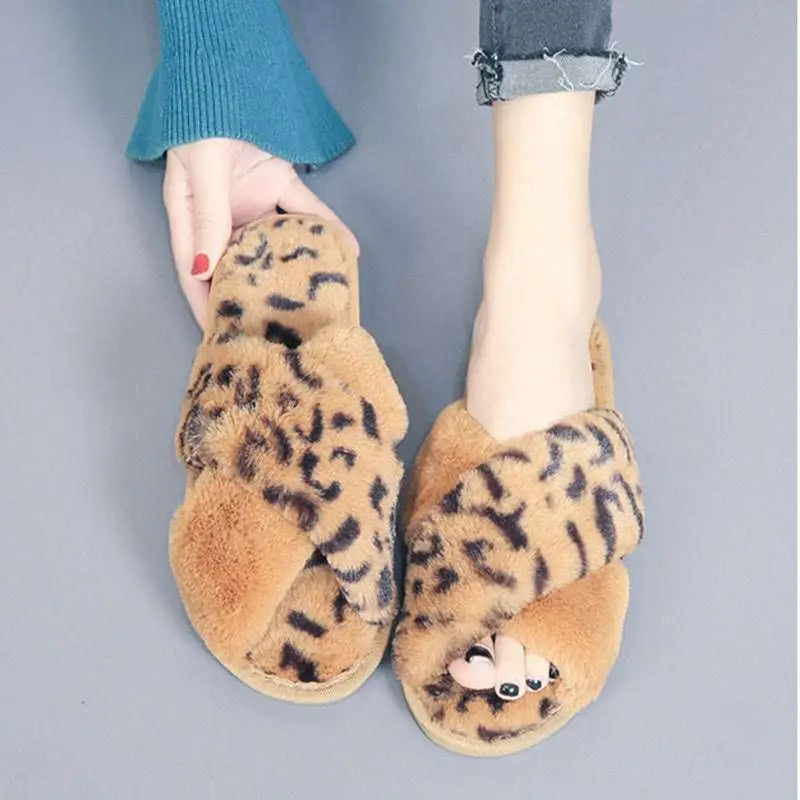 Cute tan and black leopard plush house slippers with pink cross strap and cartoon face fuzzy slide design
